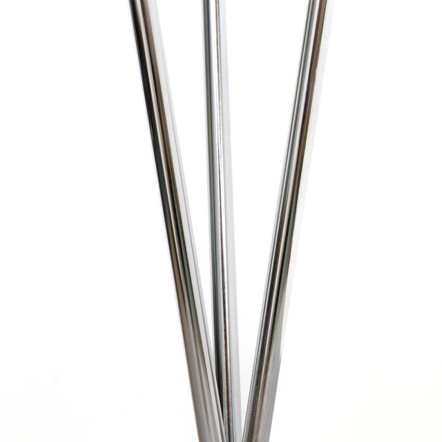 A sleek Bauhaus style coat stand dating from the 1970s. Featuring a minimalist chrome frame with a distinctive tripod base...