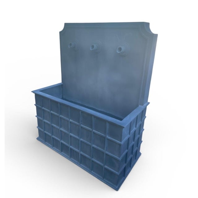 This wall fountain is a masterclass in understated elegance, crafted from heavy-gauge zinc with a beautiful, matte lead-...