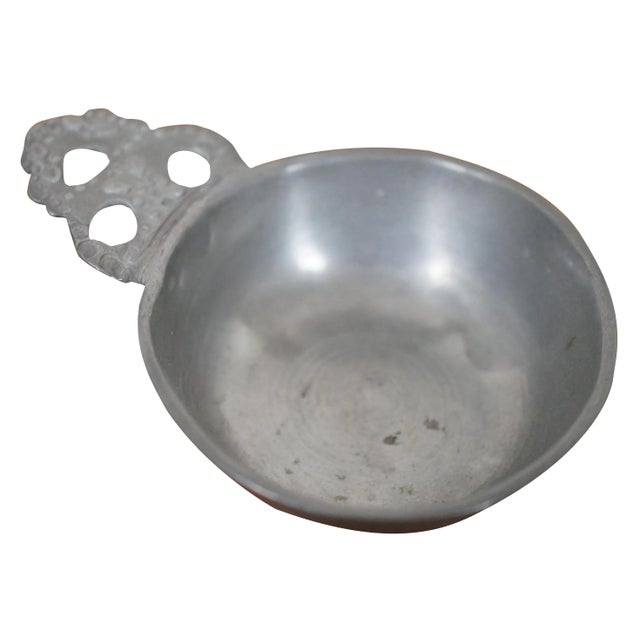 Antique circa 18th century childs pewter porringer / tastevin featuring straight sides with rim flange, flat base,...
