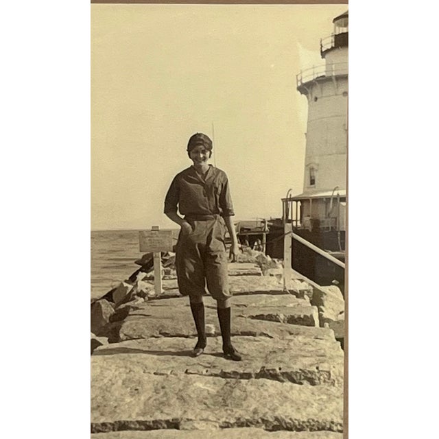 1920s original photograph of woman in Bathing Costume posing on a pier leading to a lighthouse. Well composed and printed...