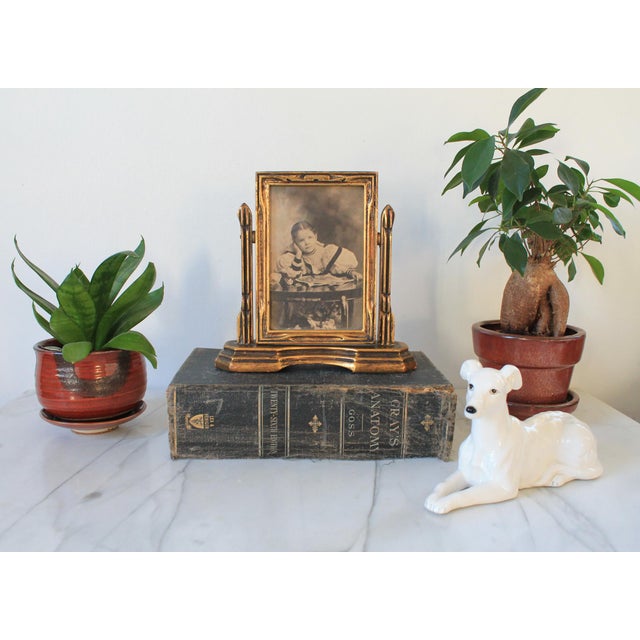 Antique gilt-wood pivot frame likely dates from the late 19th or early 20th century. Frame size is 4x6. Some age wear to...