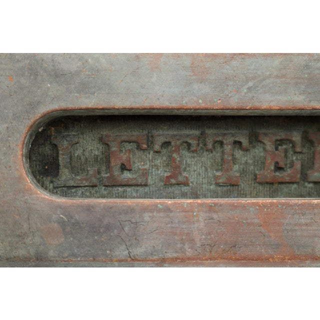 Vintage bronze spring loaded mail slot that opens inward at 45 degrees to allow mail through. This is the cover plate...