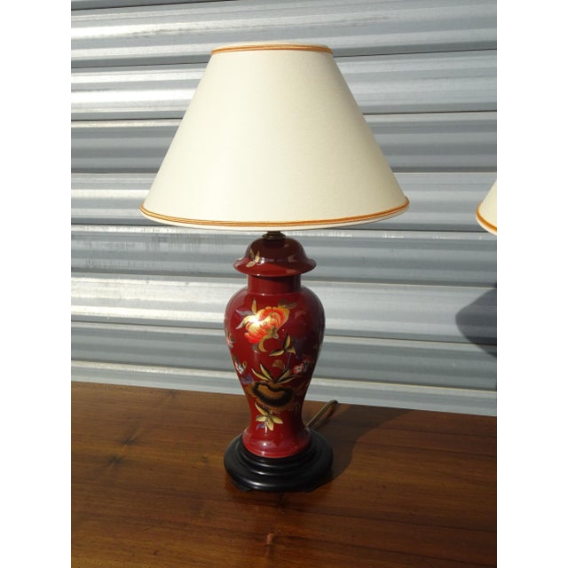 Pair of vintage Limoges porcelain bedside lamps. This retro lighting set features fine porcelain bases, each with an...