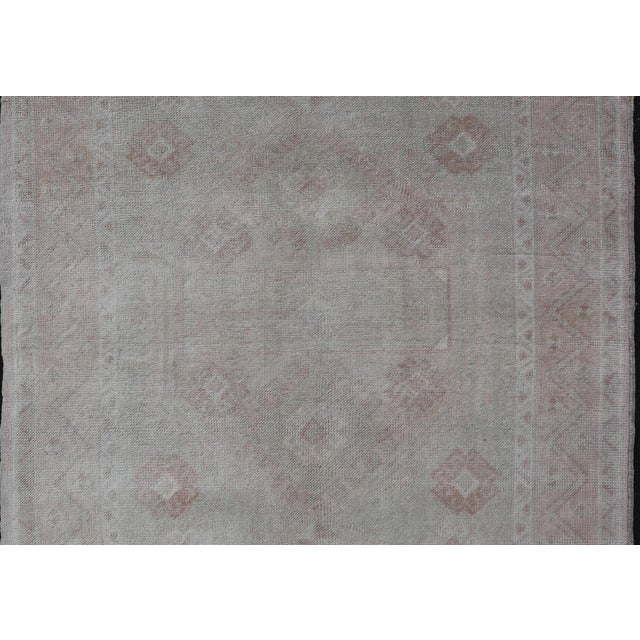 Oushak Vintage Rug with Pastel Colors in Tan, Green, Butter Yellow, and Peach. Keivan Woven Arts, Rug EN-15526, country of...