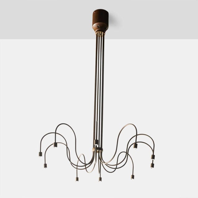 Danish Copper Chandelier A copper chandelier with 10 LED light sockets and curved arms. Wired for use in US. Height : 40.25″