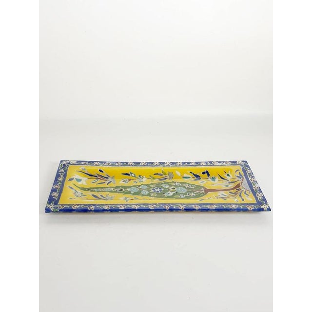 Charming colorful ceramic trinket tray from circa 1910 France, distinguished by its vibrant yellow background, deep cobalt...