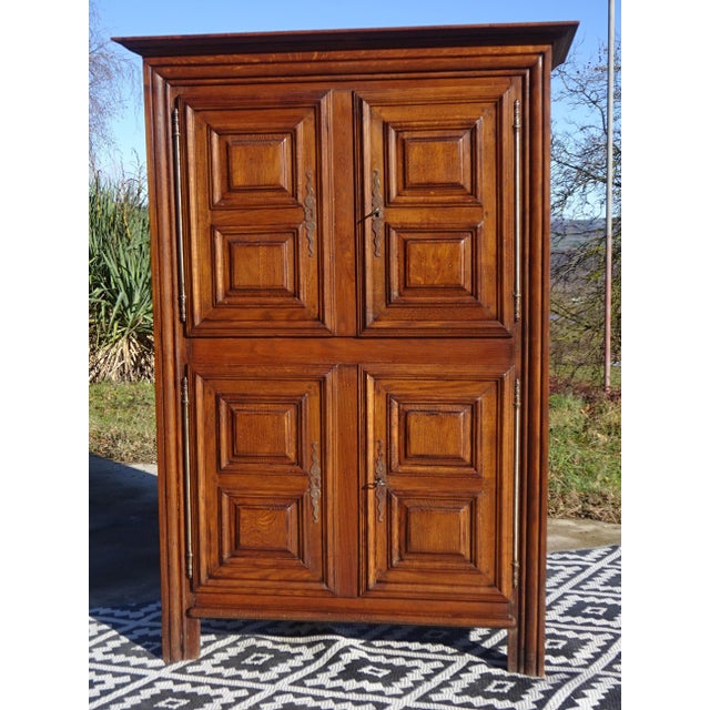 Small tall cabinet or sideboard, 166 cm high. This solid oak cabinet, in the Louis XIII style, features straight,...