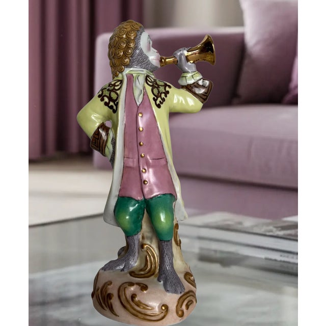 This vintage hand-painted porcelain monkey musician figurine was imported by Andrea by Sadek and is inspired by the...