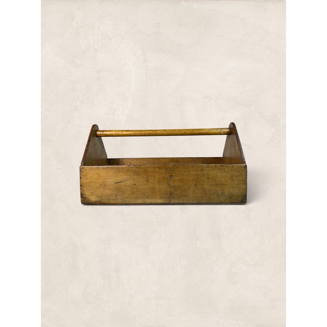 A charming English carpenter’s toolbox handcrafted from solid pine. Featuring a traditional open-top design with a turned...