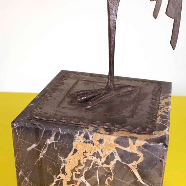 In wrought iron Height: 42 Width: 15 Depth: 15 This piece is attributed to the mentioned designer/maker. It has no...