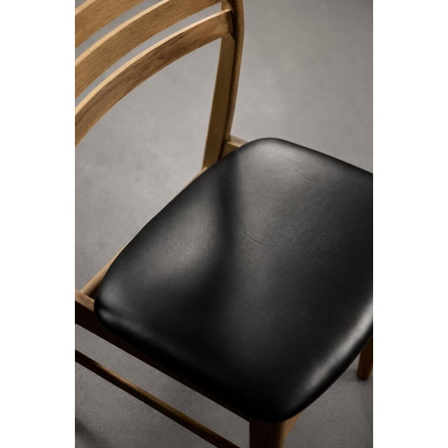This set of four dining chairs was produced during the 1960s by the Danish manufactory Sax Møbelfabrik. The chairs are...
