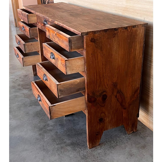 Charming old Spanish pine desk with great details the desk has nine drawers. The finish has been left natural so it has a...