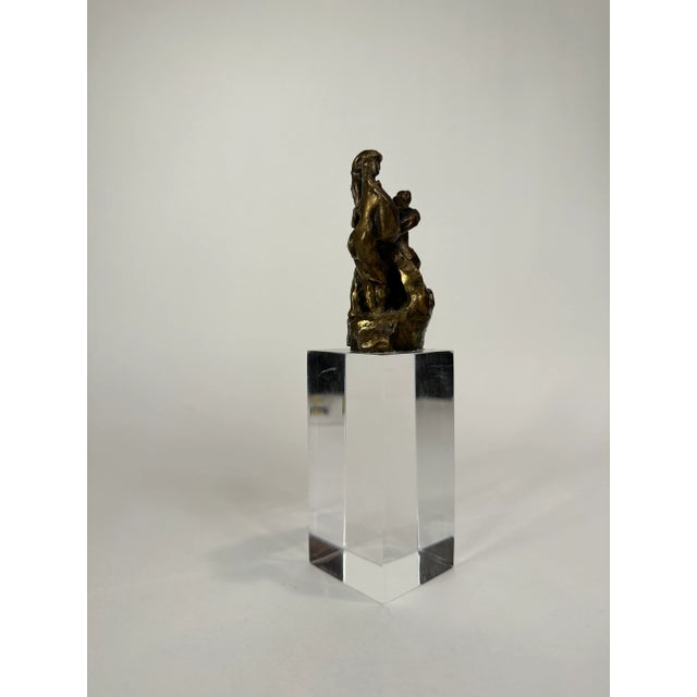 1970's modern bronze figure sculpture by M. Gristauts. Mounted on a new lucite riser
