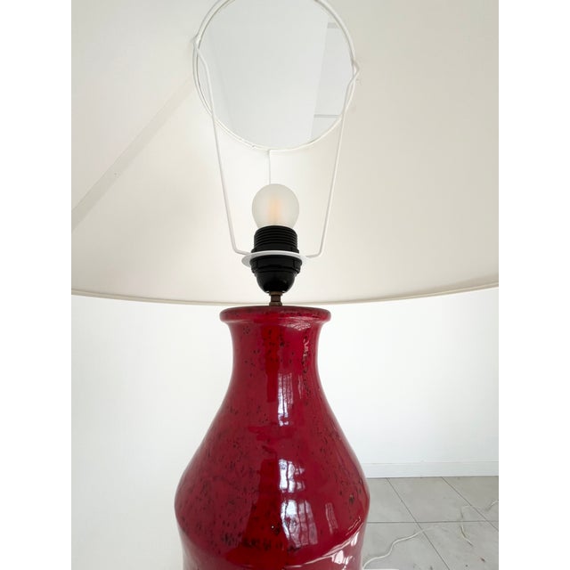 Red glazed ceramic table lamp, in the style of the Cloutiers brothers, France circa 1950 European Plug (up to 250V).The...
