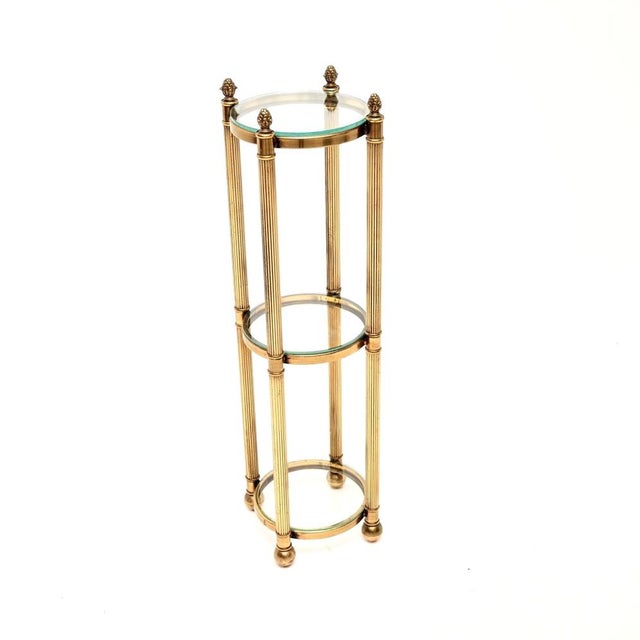A wonderful vintage French brass and glass three tier side table, dating from around the 1960-70’s. It is of superb...