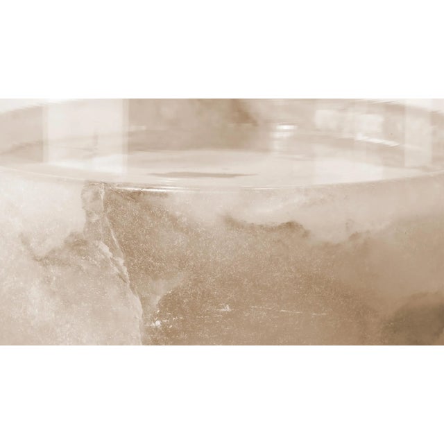 Set atop a hand-carved alabaster base, our artisan made candle holder displays a stunning material mix of organic...