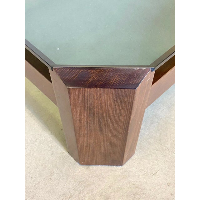 Coffee table from the 1970s with wooden frame and smoked glass top.