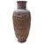 Pre-war hand hammered copper vase showcases an intricately detailed Asian dragon winding gracefully around its surface....