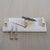 A luxurious blend of natural stone and metallic accents, this marble tray exudes understated elegance. The smooth white...