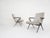 Black metal lounge chairs with new beige velvet upholstery. Designed by the Dutch Designer Friso Kramer for Ahrend de...