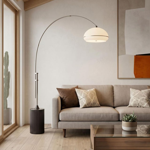 Satin Nickel paired with a Wood base defines the Tambo Arc Lamp, a contemporary arc lamp designed for versatility and...