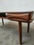 Modern Danish table with through drawers and a bow tie by Dyrlund, 1960s, made of teak. Includes a shelf with a drawer at...