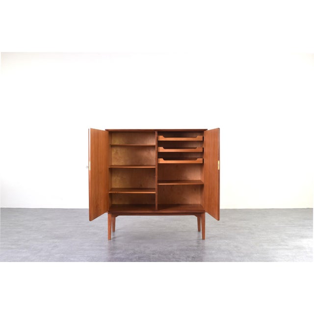 This teak highboard was designed by the designer couple Rolf Rastad & Adolf Relling in the 1950s and manufactured by...