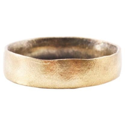 Bronze, with a 24karat gold face band, 5.4mm wide. Surface lightly textured from burial. Vikings exchanged rings on the...