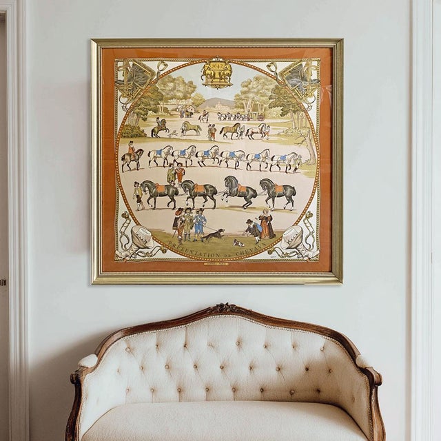 Bring French luxury and history into your home with this authentic framed Hermès silk scarf, beautifully presented in a...
