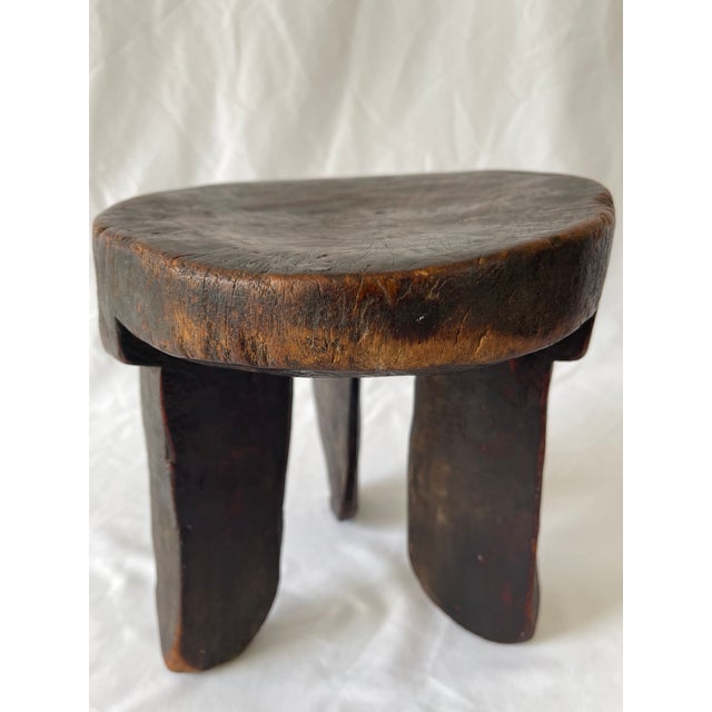 Early 20th century African Oromo sculptural hardwood tripod stool, carved from one piece of native wood. Beautiful worn...
