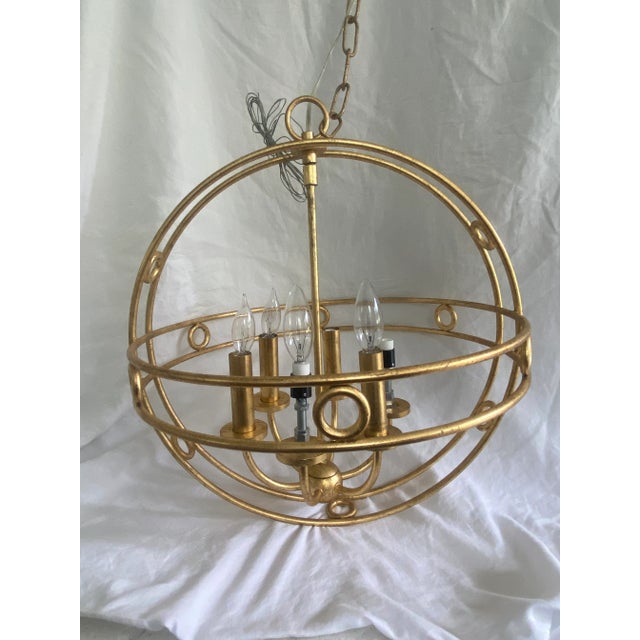 A vintage Art Deco style indoor gold chandelier. Beautifully designed and in working condition,.