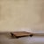 A raised wooden platform, originally conceived as a display corner for the domestic objects designed by Achille...