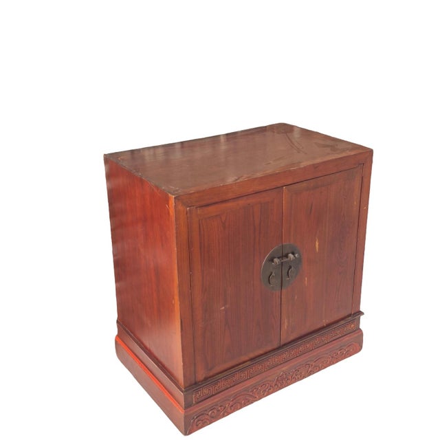 This refined 19th century cabinet is made of solid elm wood with a warm, reddish-brown lacquer finish that emphasizes the...