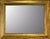 Dating from the 1980s, this Italian wall mirror features a substantial rectangular wooden frame with a warm gold-leaf...