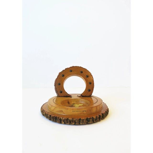 A 'Catskill Mountains' wood catch-all piece, circa mid-20th century, USA. Piece is hand carved of raw wood, varnished,...