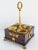 Early 19th Century Empire gilded bronze and burl wood inkwell featuring four vessel, three for ink and one for pounce. The...