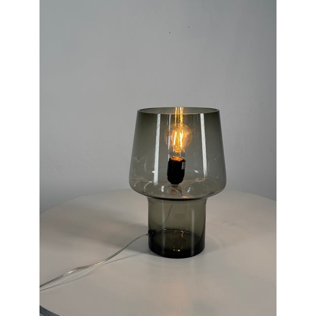 Original Muuto Cosy in Grey table lamp designed by acclaimed Finnish designer Harri Koskinen. The lamp is crafted from...