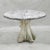 A charming set of faux bois garden garden furniture C1960s France. A large round table and two curved benches, brimming...
