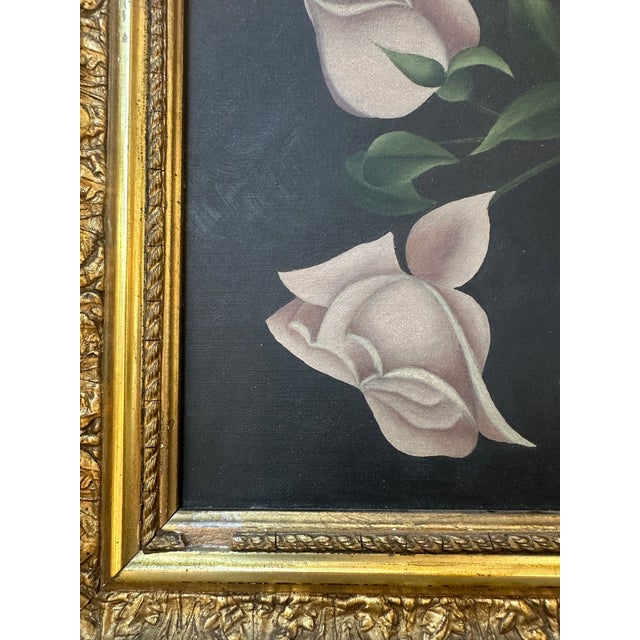 Beautiful antique still life painting depicting pale blush flowers with deep green leaves against a dark, moody...