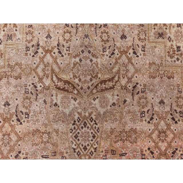 A fine example from the DLB collection of early 20th century Persian Tabriz carpets, the cream field with a condensed...