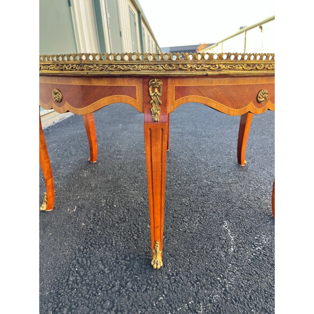 A stunning Italian style round coffee table made in Spain during the mid 20th century. This exquisite coffee table...