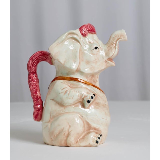 Charming early 20th century French Sarreguemines Majolica elephant pitcher. Beautifully modeled as a whimsical elephant...