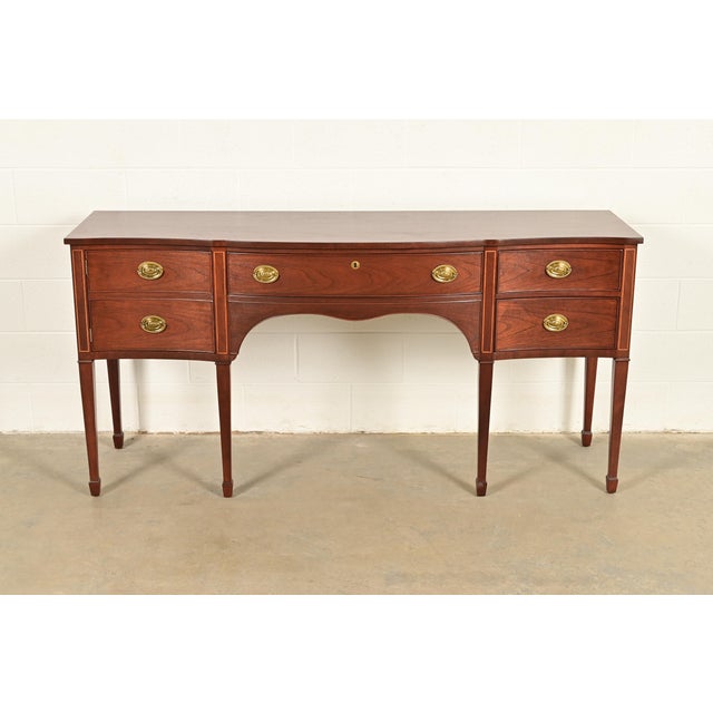A gorgeous Hepplewhite or Federal style sideboard, buffet, or credenza By Kindel Furniture USA, Circa 1980s Mahogany, with...