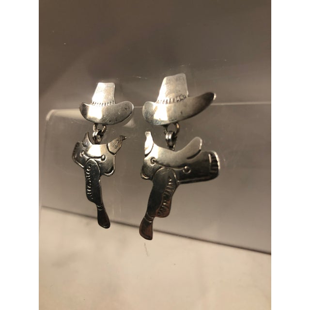 Giddy up! This fabulous pair of Cowboy Hat and Saddle Sterling Earrings will be the perfect option for your next trip to...