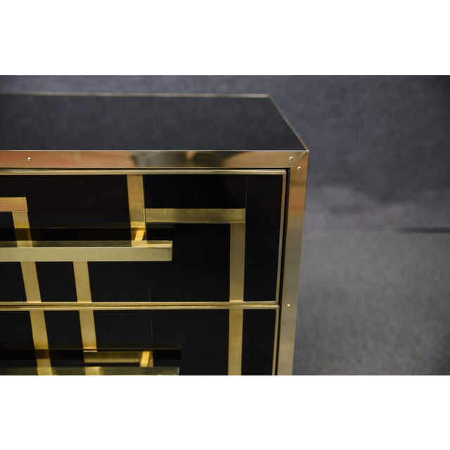 Our handcrafted nightstands offer timeless elegance with their refined design. Featuring black opaline glass and brass...