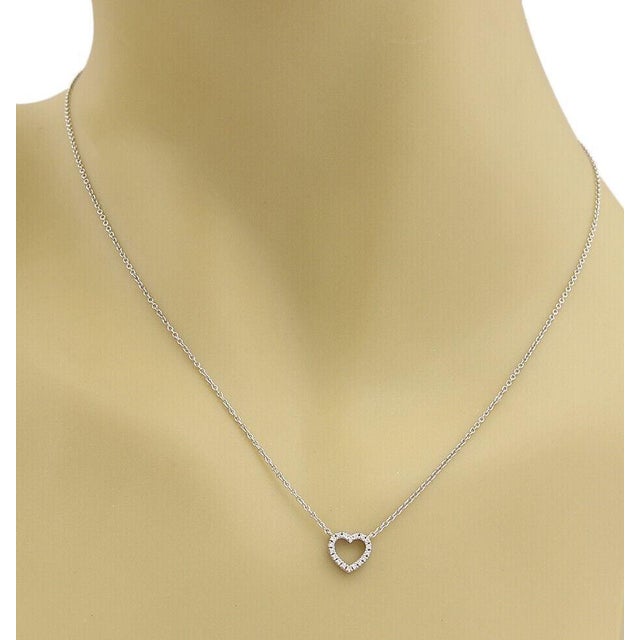 This authentic Tiffany & Co. necklace from the Metro collection is crafted in solid 18k white gold and features a delicate...