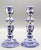 A lovely pair of Mid Century Dutch Delft candlesticks. They are hand painted in the traditional colors of blue and white...