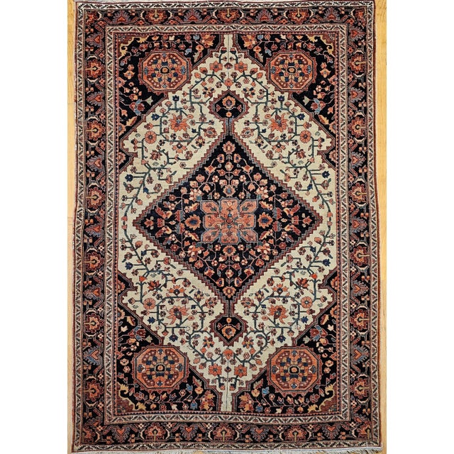 A beautiful late 19th century Persian Farahan Sarouk area rug, finely hand-knotted with a Persian Garden floral design of...