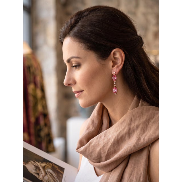 These refined long drop earrings are crafted in radiant 14K yellow gold and feature four natural pear-shaped pink topaz...