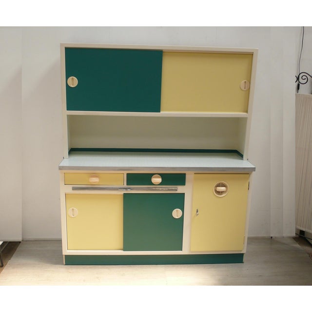 1950s kitchen cabinet, consisting of upper and lower cabinets, in cream-white with pastel yellow and petrol green: 4...